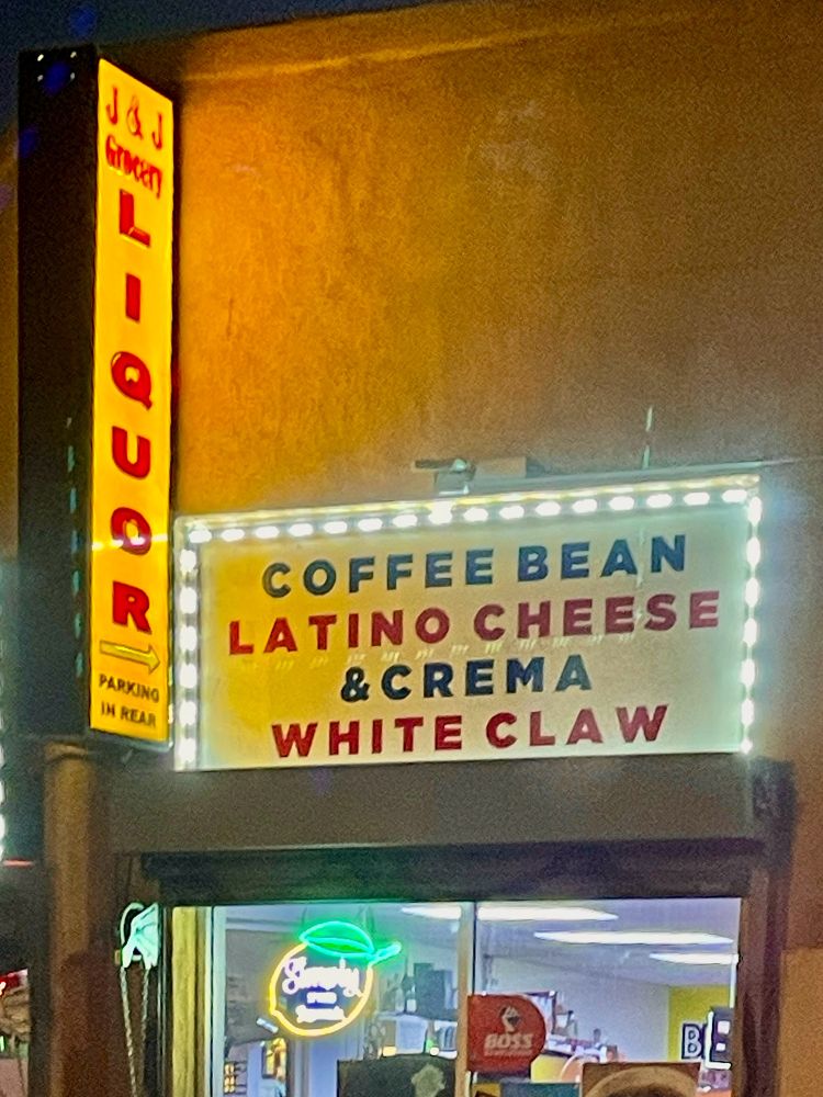Shop sign advertising an array of products: 
- coffee bean
- Latino cheese & crema
- white claw