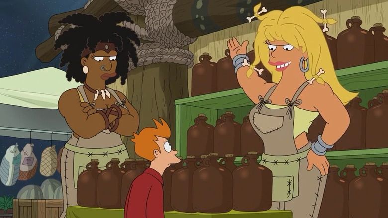 From Futurama, two giant women tower over Fry, who doesn't know whether to be scared, turned on, or both 