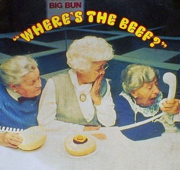 3 elderly women examining a burger with a tiny beef patty inside, calling the store and asking 'where's the beef?. Wendy's ad 1984, poking fun at  other burger chains.