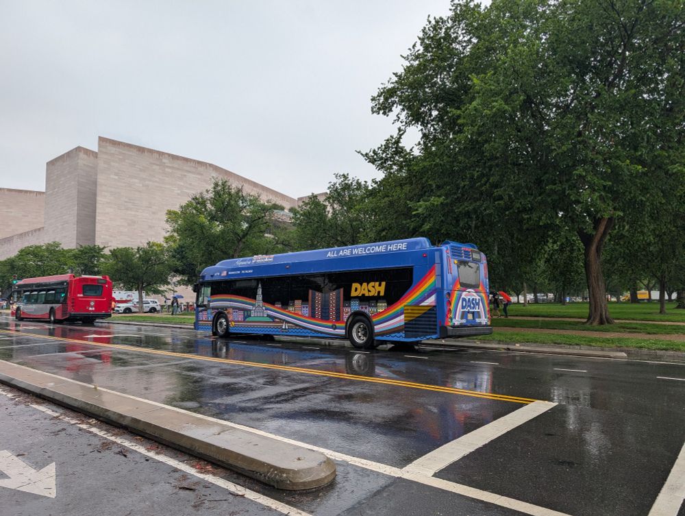 Pride DASH bus in the rain on the National Mall.