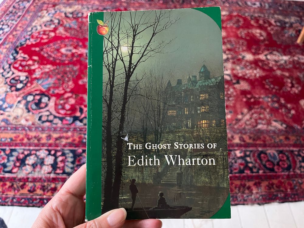 A characteristically green-edged Virago paperback edition of The Ghost Stories of Edith Wharton 