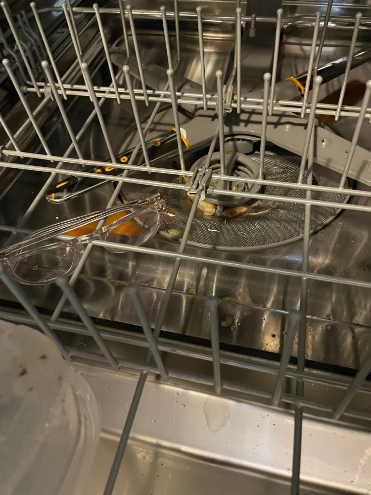 Pair of lost glasses inexplicably found inside empty dishwasher. 