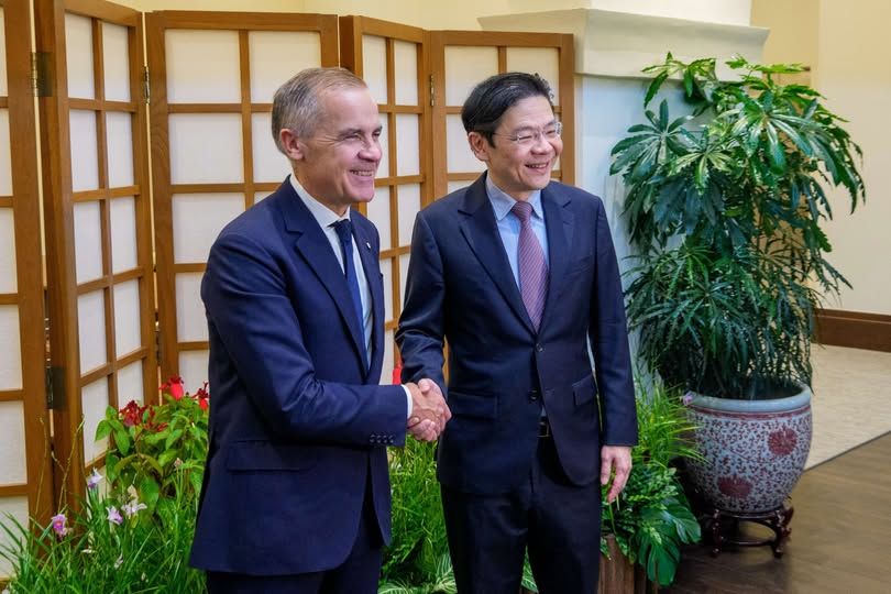 PM Mark Carney of Canada shaking hands with PM Laurence Wong of Singapore October 29th in Singapore.