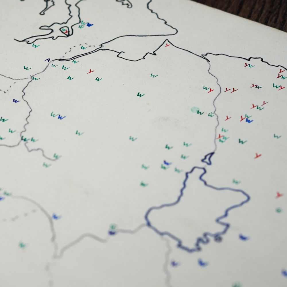 A view of a of Northern Ireland. Letters representing different ways of saying the number one dot the map.