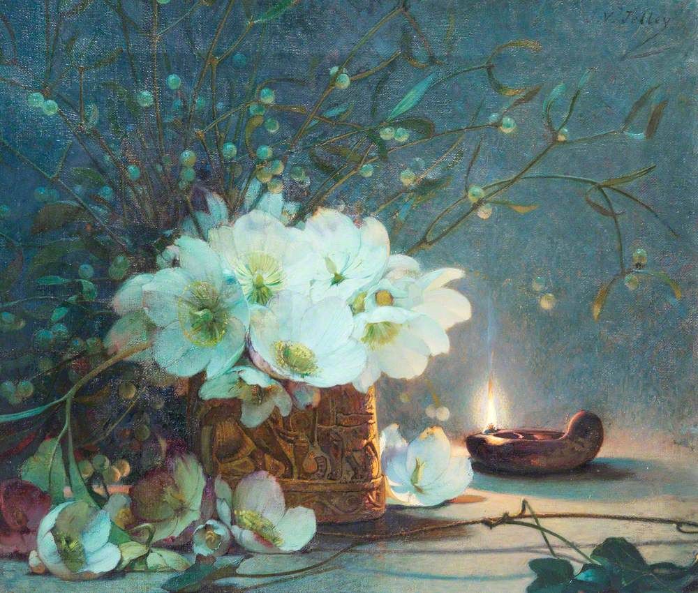 White roses in an orange jar. There's a candle in the background and stems of mistletoe