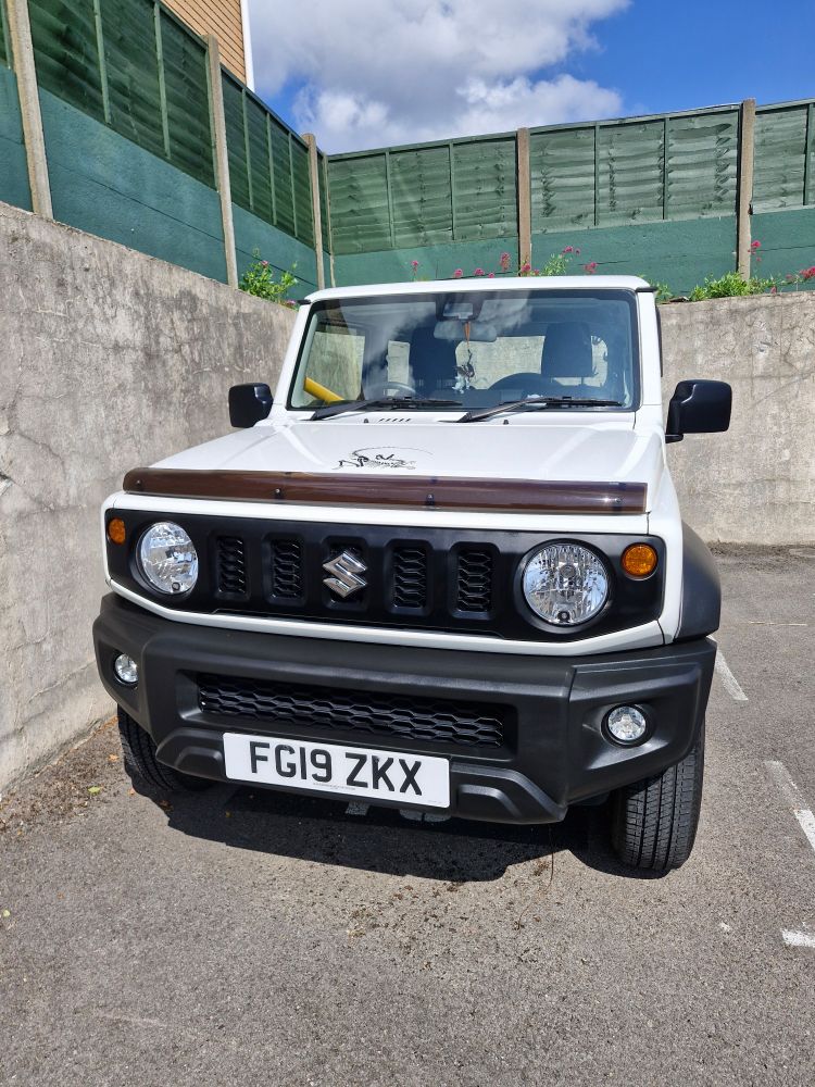 A very clean white Suzuki jimny