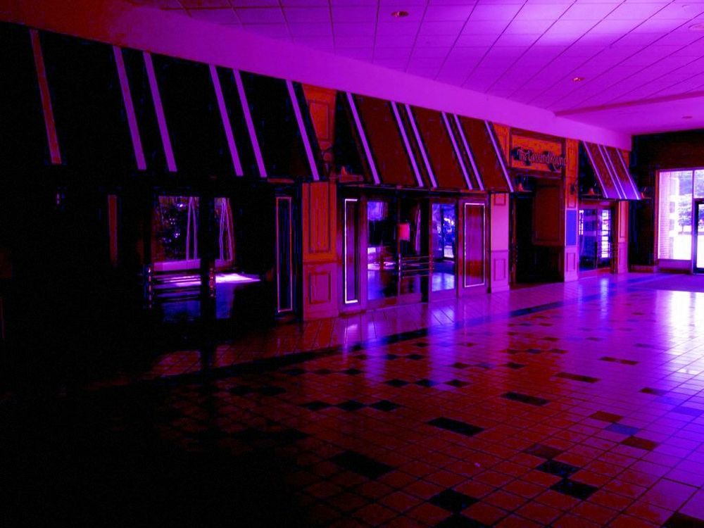Dimly lit shopfront tinted pink
