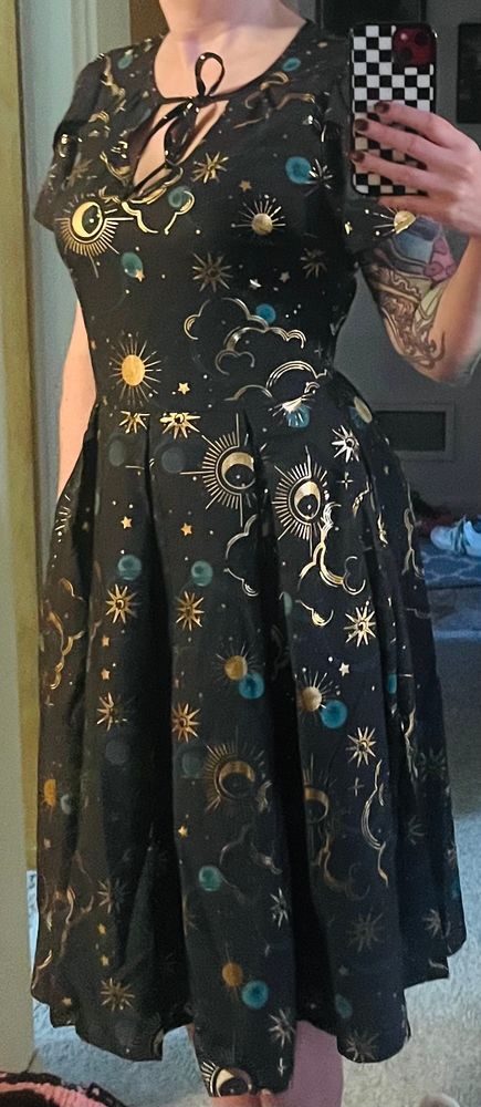 Mirror selfie in a black dress with a gold celestial pattern, my head is missing