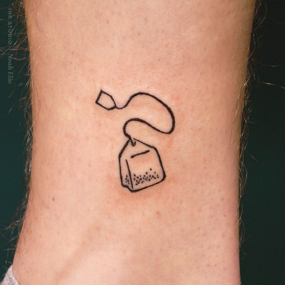 photo of a tattoo showing a tea bag