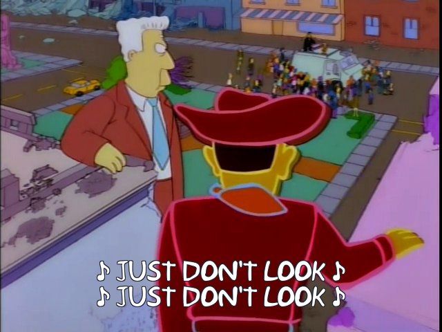 A scene from a classic Simpsons Treehouse of Horror in which TV personalities and advertisements have come to life and are wrecking Springfield. Lisa Simpson and Paul Anka sing "Just don't look! Just don't look!" to starve them of attention and kill the walking ads.