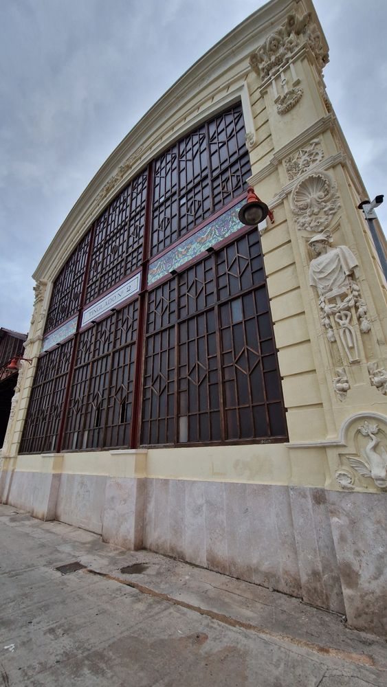 old warehouse with nice windows, sculptures and fancy tiles