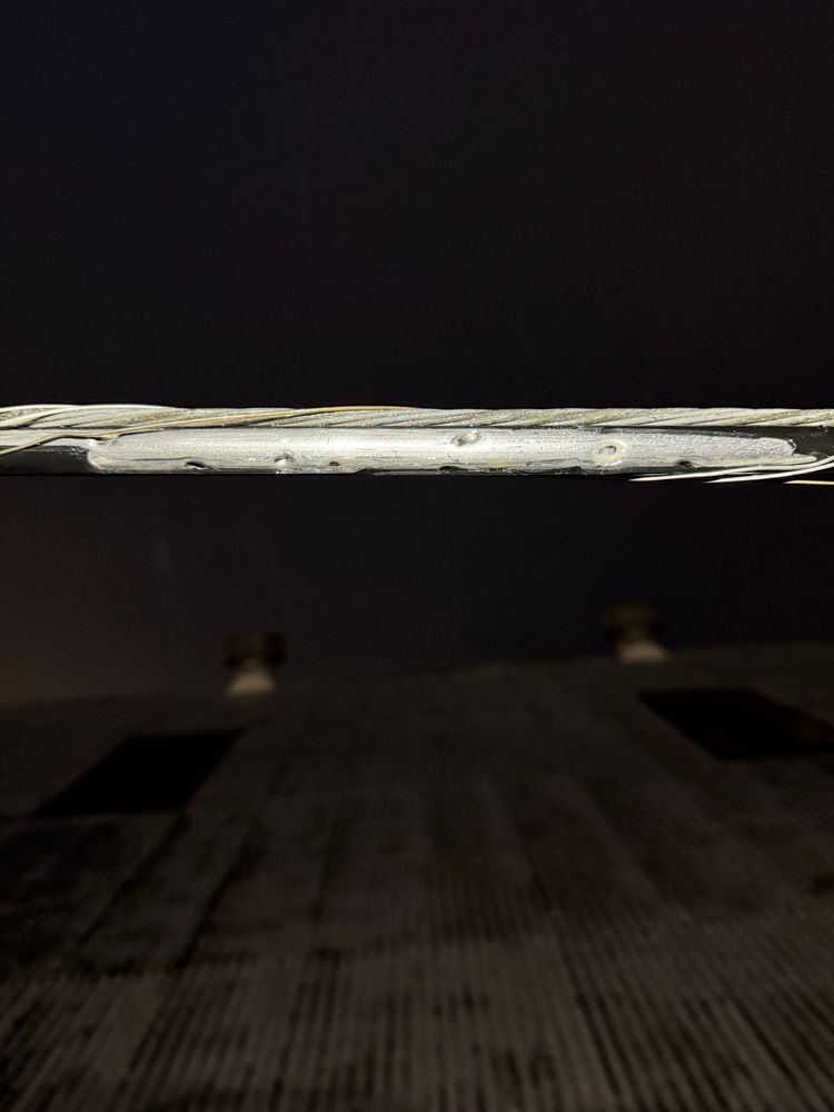 Image of hardline distribution cable damaged by multiple bird shot pellets