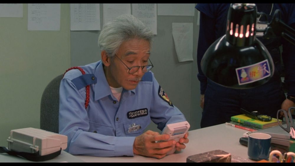 old security guard playing dr mario on game boy in welcome back mr mcdonald (1997)