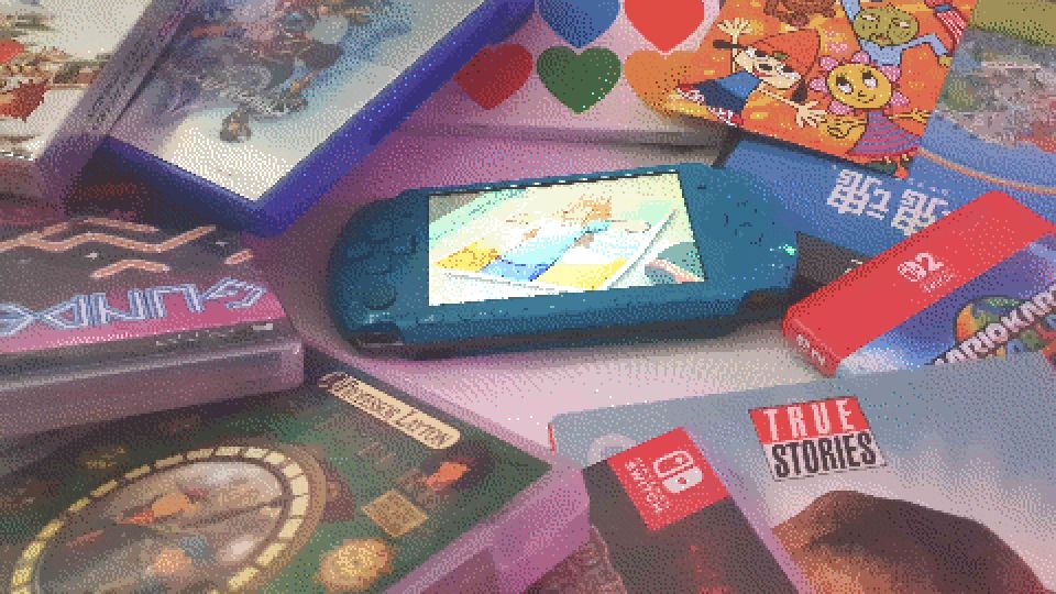 photograph of a teal psp playing one of my videos surrounded by various media i've discussed, including copies of katamari damacy, mario kart world, kingdom hearts 2, true stories, professor layton, gunpey and the seven colors legend of psy-s city