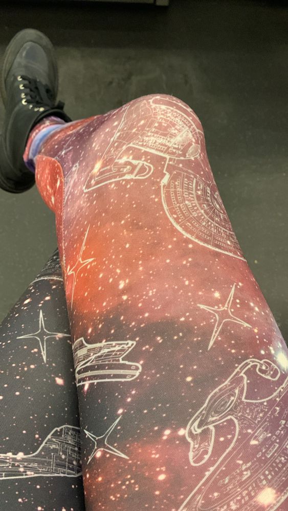 The leggings have patterns of the USS Enterprise D on them, stencilled on top of a star field 
