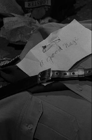 Fascist Uniform with a piece of paper that reads, "a good nazi"