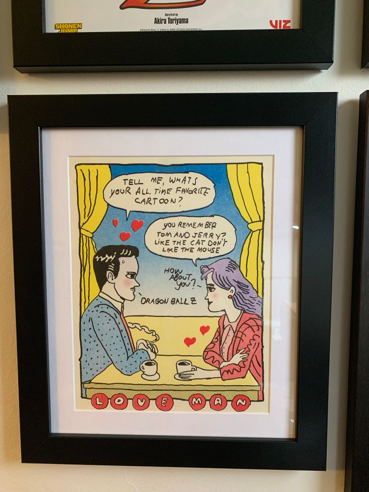 A Love Man print by Goodbye Press. Love Man asks his date, “Tell me, what’s your all time favorite cartoon?” The woman says, “You remember Tom and Jerry? Like the cat don’t like the mouse. How about you?” Love Man (sweating slightly) says, “Dragon Ball Z”