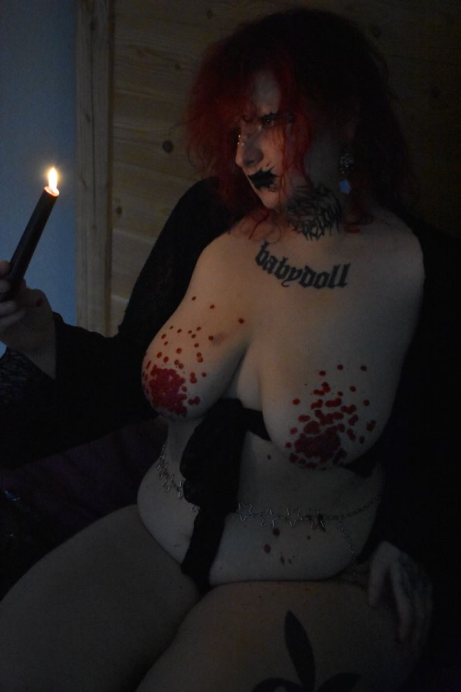 Rat stares at the candle. It looks ethereal and beautiful 