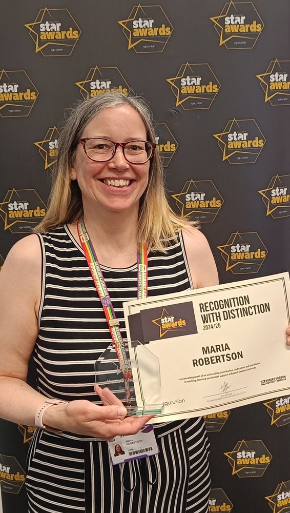 Very smiley Maria with her award on the night in front of a Star Awards backdrop