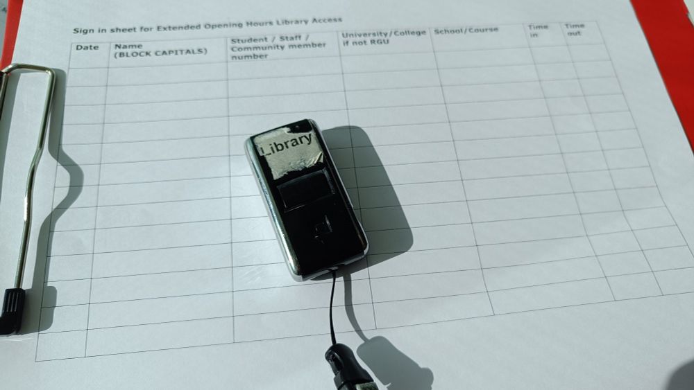 Manual sign in sheet and ID card scanner as used in Extended Hours 