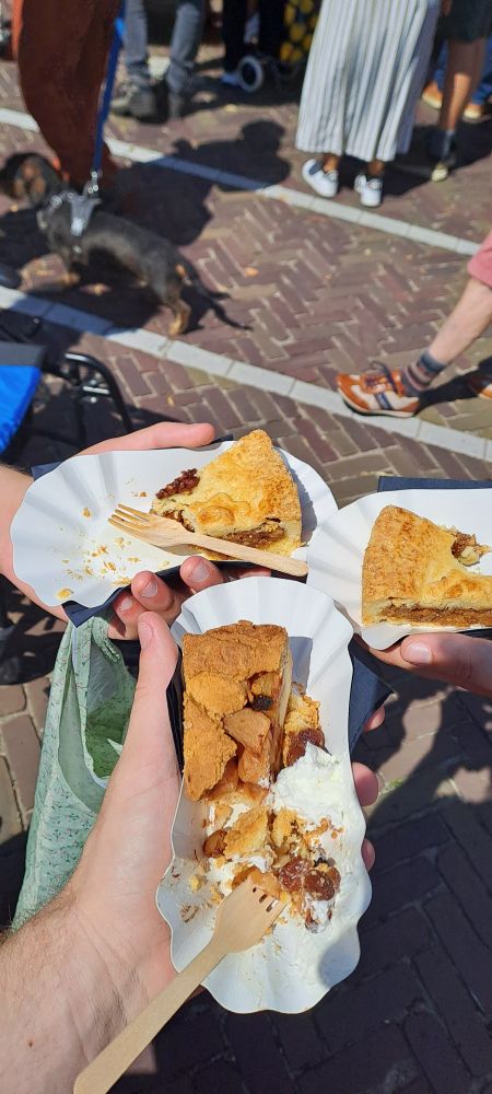three slices of pie, the one in front being an apple pie while the others are pecan pie.
