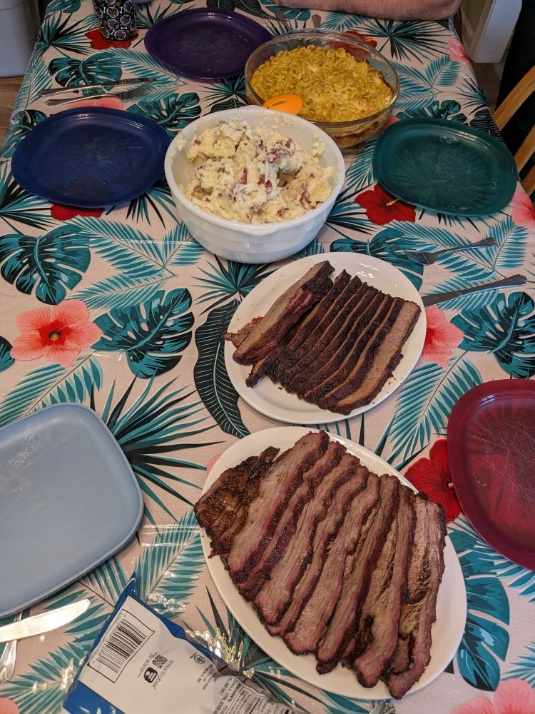 Homemade smoked brisket, mashed potatoes, and Mac and cheese on my kitchen table.