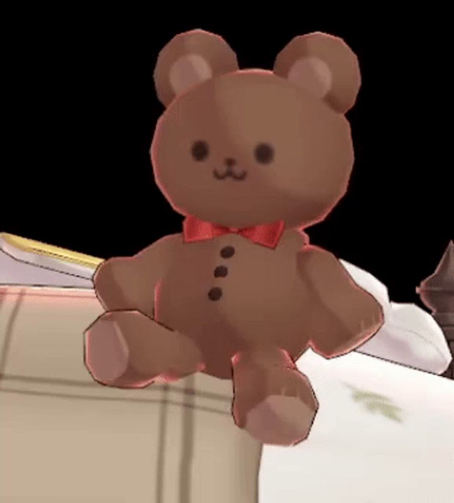 a brown teddy bear with a red bow on it