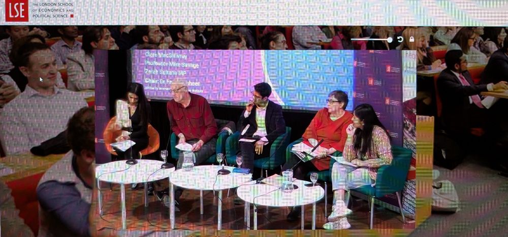 A picture of a laptop screen, showing a panel deep in discussion.