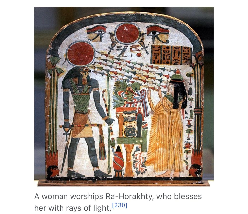 A woman worships Ra-Horakhty, who blesses her with rays of light