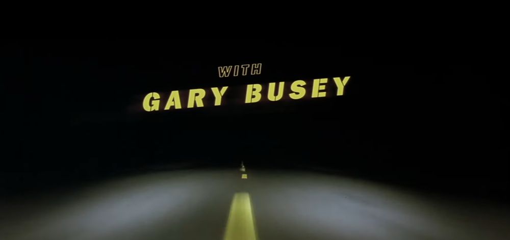 A still from the opening credits of David Lynch’s “Lost Highway” that says “With Gary Busey.”