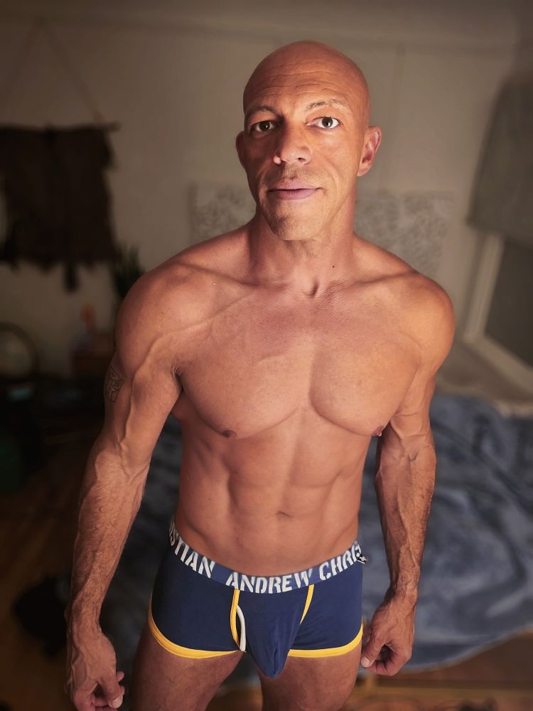 Rob Denali posing in Andrew Christian brand trunks