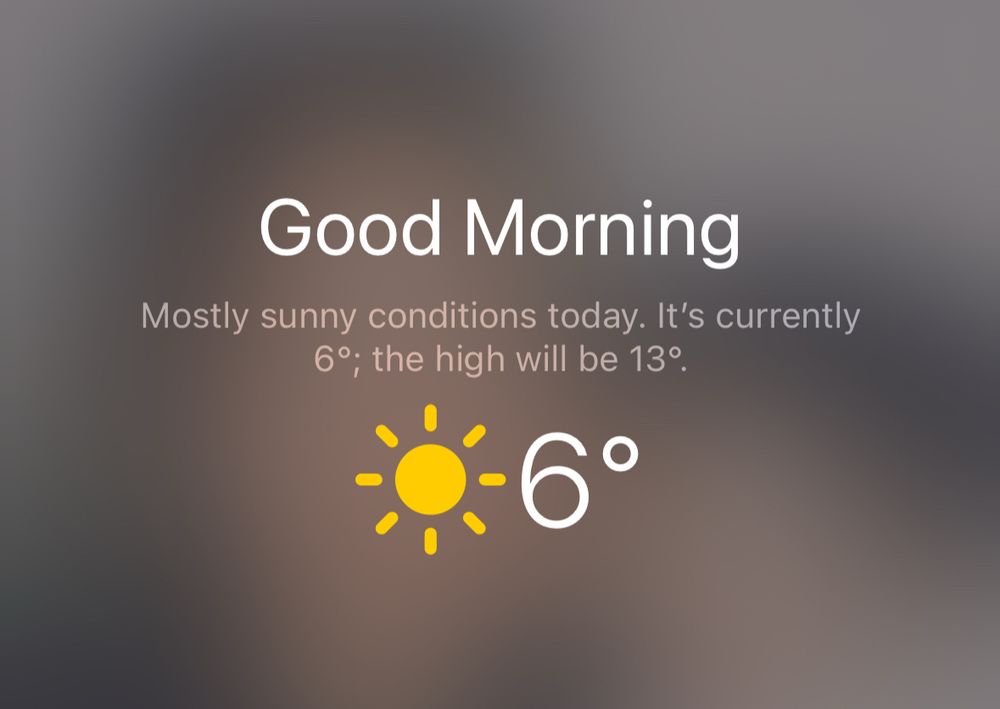 Screenshot of a weather app greeting “Good Morning,” stating “Mostly sunny conditions today. It’s currently 6°; the high will be 13°,” with a yellow sun icon next to the temperature 6°.