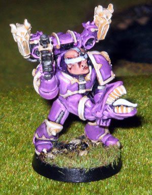 A blind folded emperors children space marine holding a tentacle 