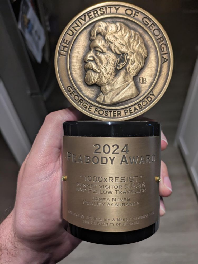A hand holding a 2024 Peabody Award statuette awarded to 1000XRESIST. 
James Neves Quality Assurance 