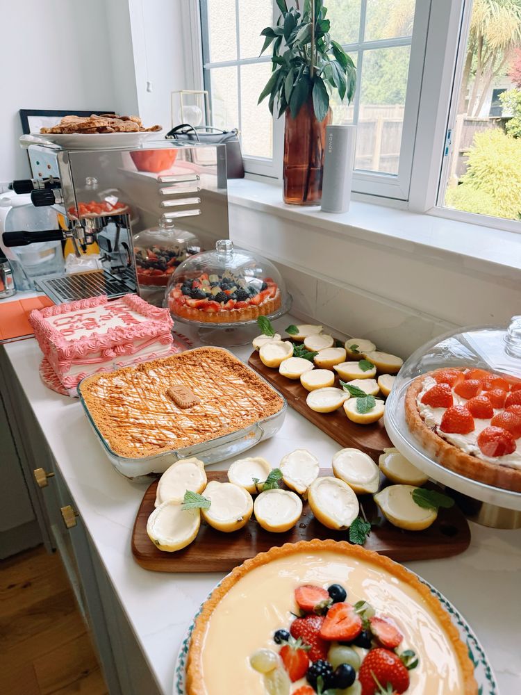 Picture of an assortment of desserts including lemon posset, flan cakes and traditional cakes