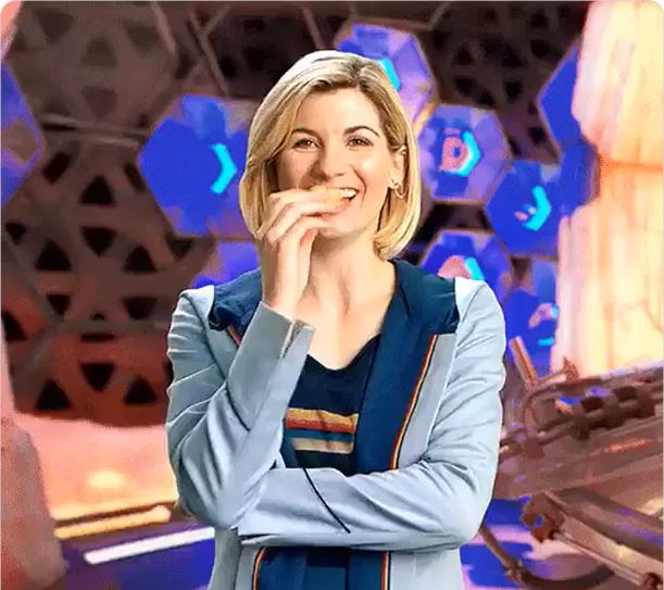 Jodie Whittaker about to happily scoff a Custard Cream!