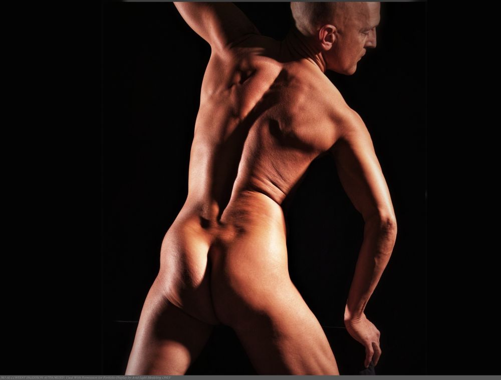 Color photo of make nude model viewed from behind, cropped 