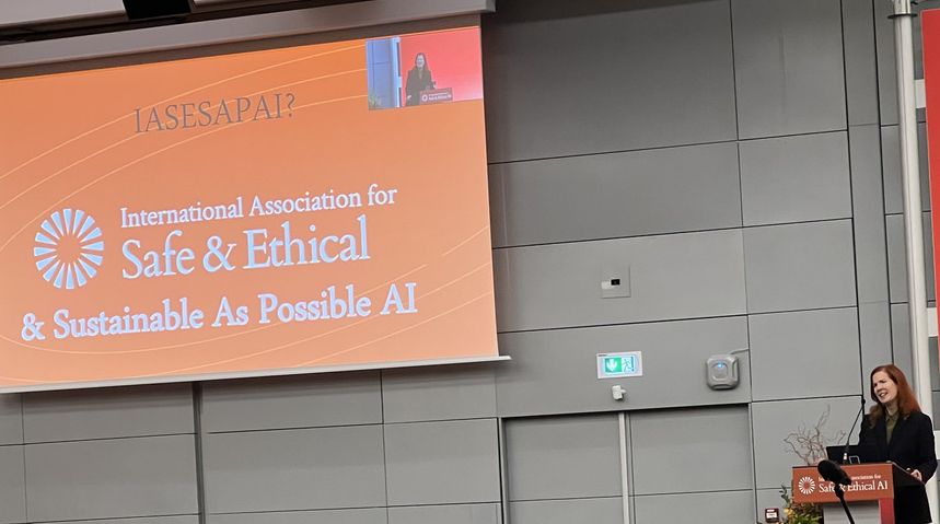 Kate Crawford speaking at conference showing slide with alternative name