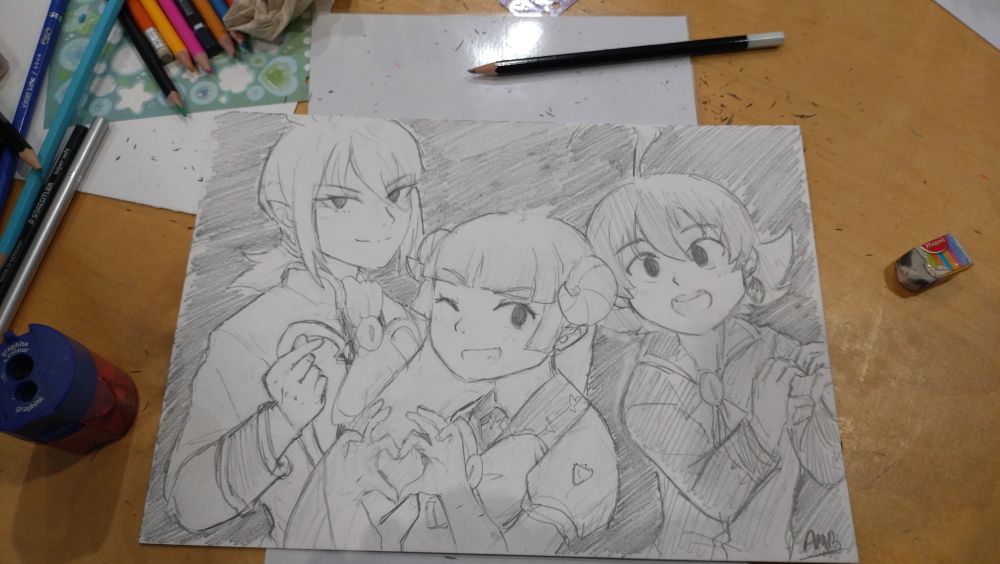 Photo of a pencil drawing of Asmodeus Clara and Iruma from Mairimashita Iruma-kun, each making different heart signs with their hands. No color
The drawing is on a table and there's colored pencils and other basic drawing tools