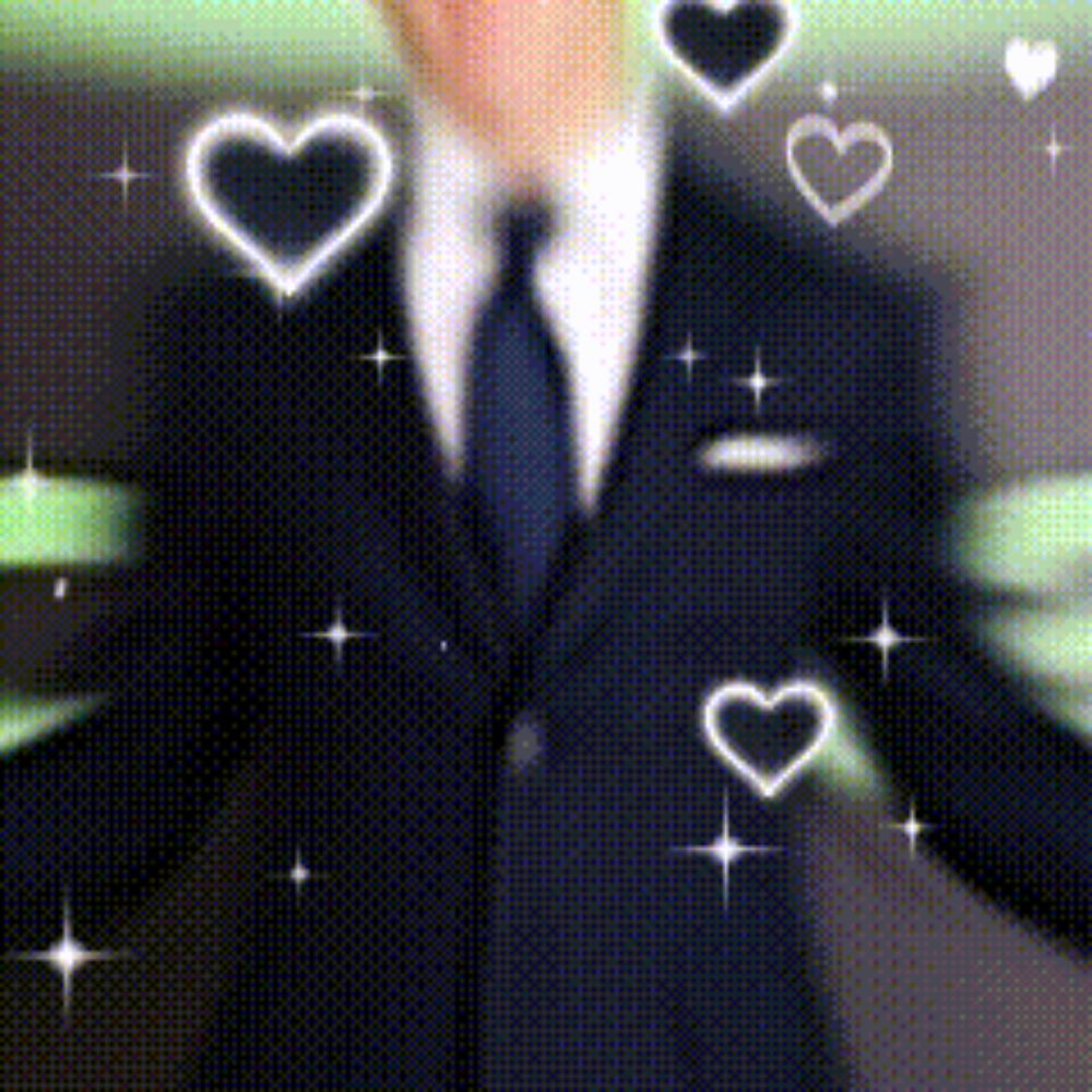 a man in a suit and tie with hearts surrounding him