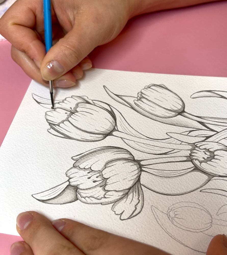 Grayscale flowers in the process of being painted