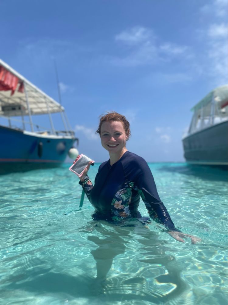Me posing in blue waters of the Caribbean with boats in
the background.