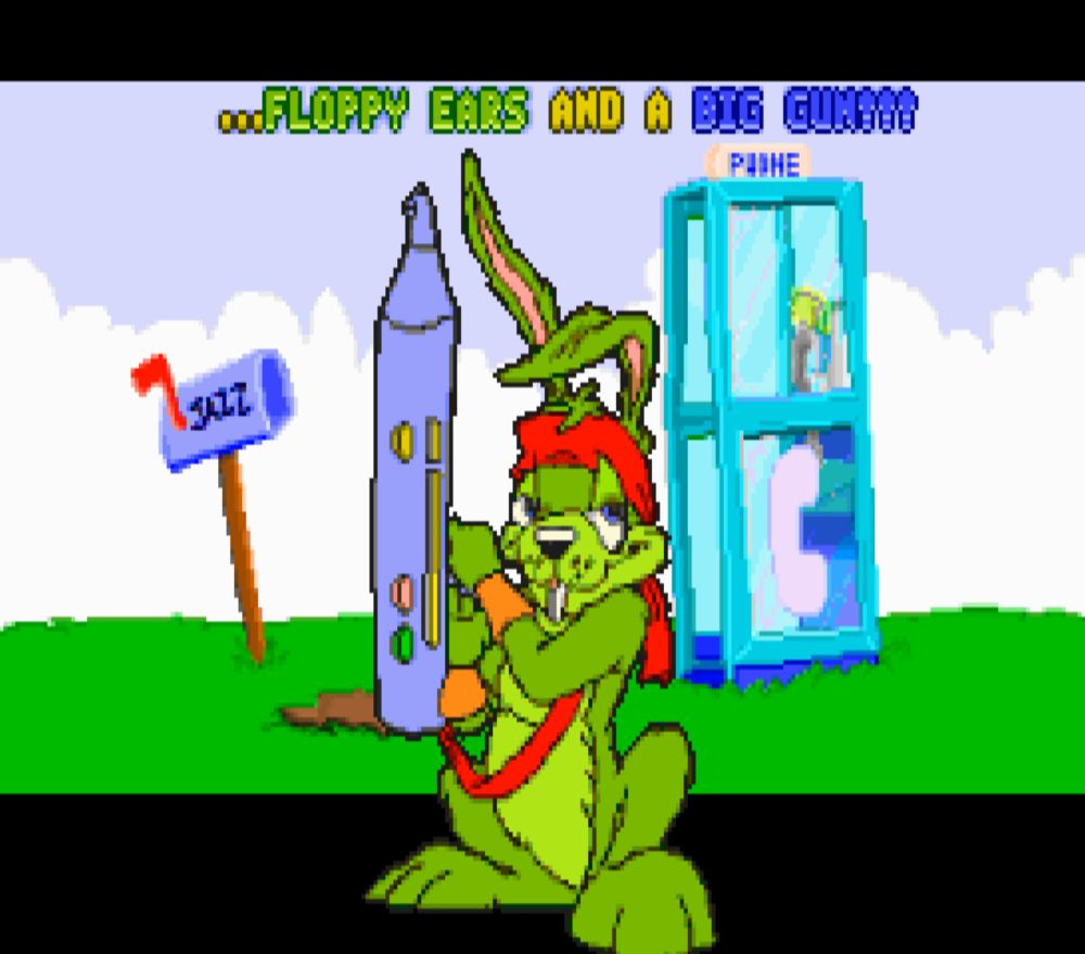 Screenshot from the Jazz Jackrabbit intro where he's standing in front of a phone booth holding up his blaster. At the top is a caption that says "...floppy ears and a big gun!!!"