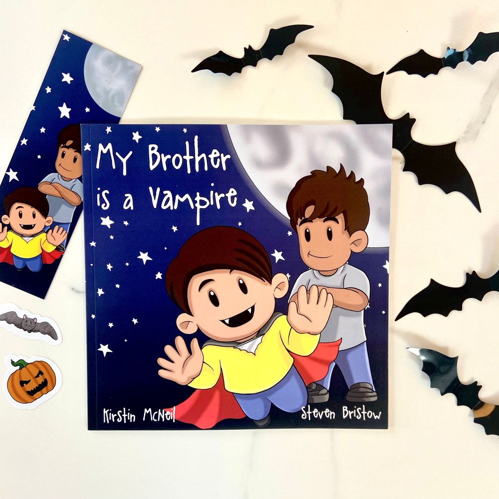 Front cover of My Brother is a Vampire. Features two brothers of mixed heritage skin tone. The vampire brother is at the front dressed as a vampire 