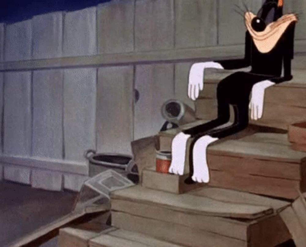 a cartoon cat is sitting on a set of wooden steps .