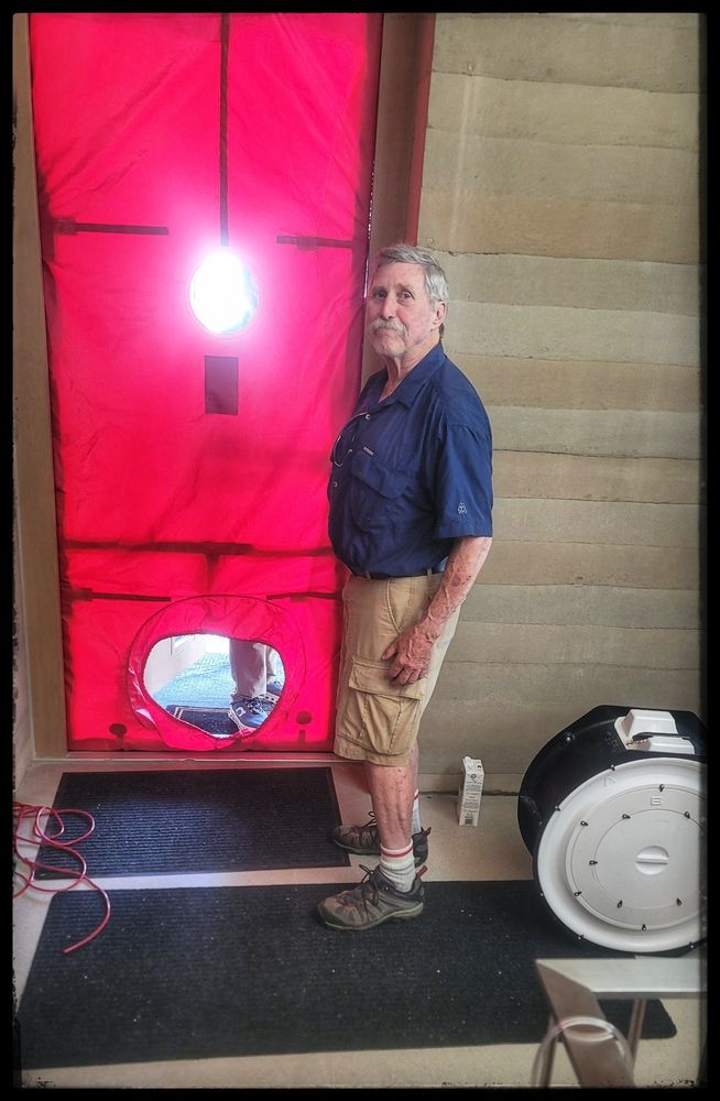 Don Eaton checking out blower door tests in 2025