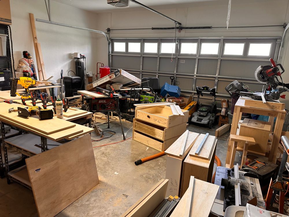 Garage workshop messily organized with wood and tools