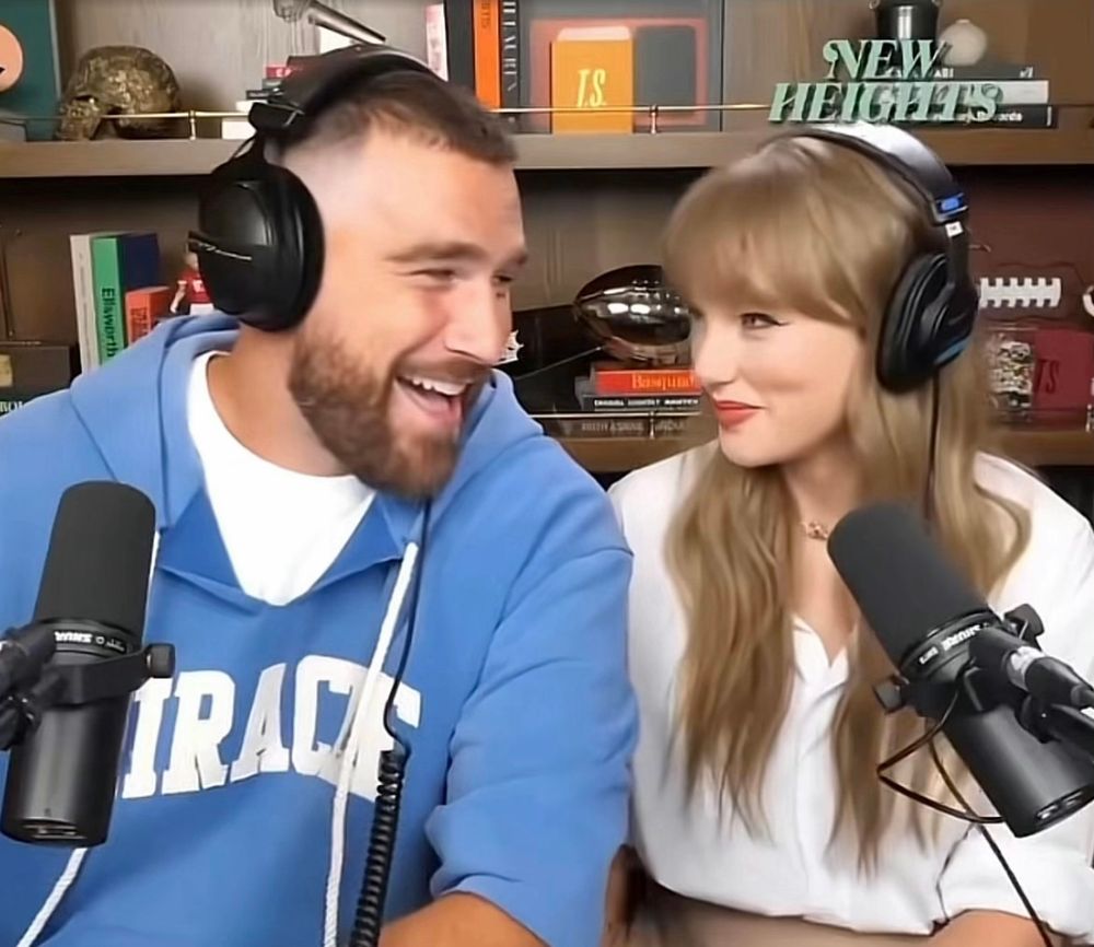 two love birds gazing into each other’s souls (taylor swift and travis kelce looking at each other on new heights podcast) 
