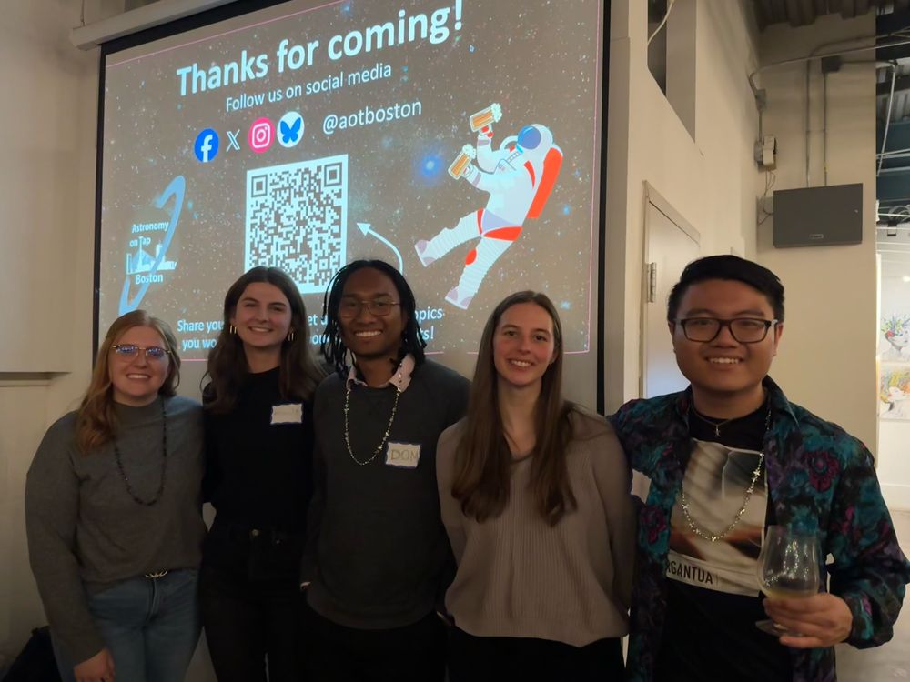 Five people posing for a photo in front of a “Thanks for coming!” slide with aotboston social media information 
