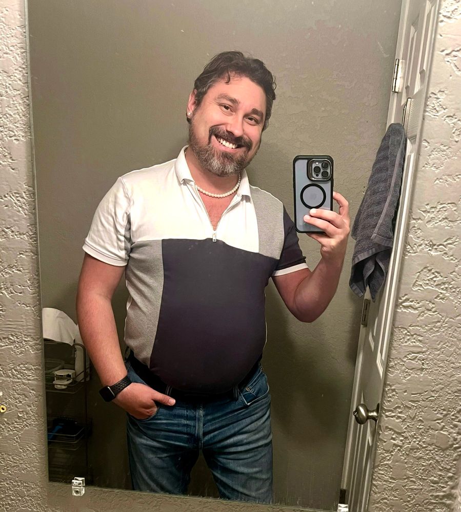 A man taking a mirror selfie